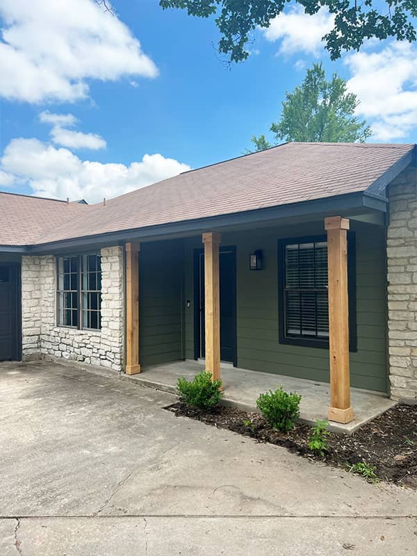 Ranch home with Hardie siding, limestone and cedar porch posts in Austin, TX