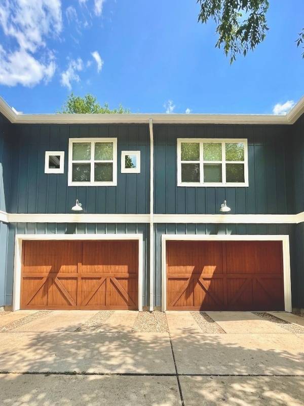 Navy board and batten siding over a two-car garage in Austin, TX