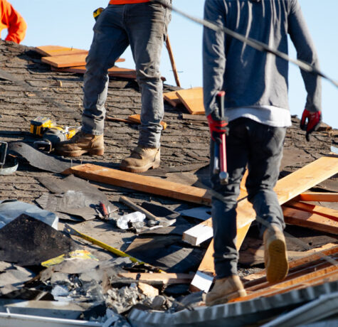 Roof replacement compared with localized roof repair showing damaged shingles and full installation process