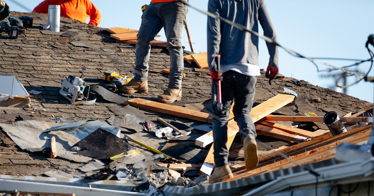 Roof replacement compared with localized roof repair showing damaged shingles and full installation process