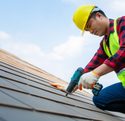 Homeowner protecting your roof from weather damage through seasonal roofing inspection and maintenance