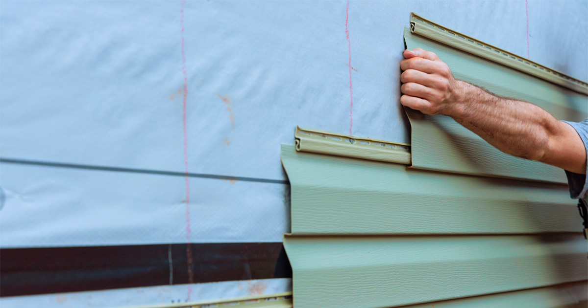 Lap Siding Installation on a residential home by professional contractors