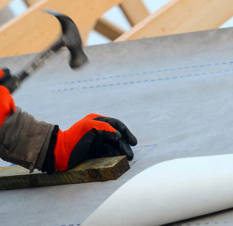 Roof Underlayment installed beneath asphalt shingles during a residential roofing project