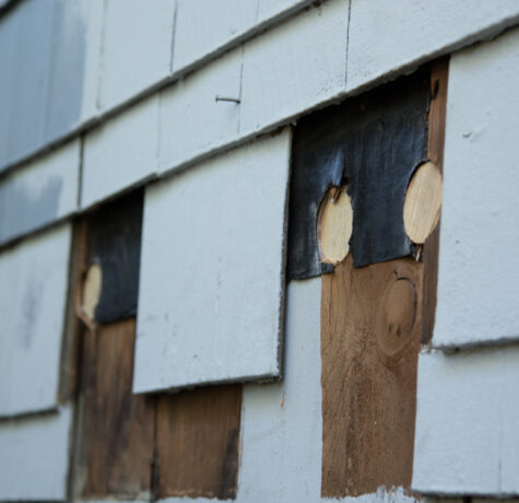 Shingle Siding Replacement showing cracked and weathered exterior shingles on a residential home