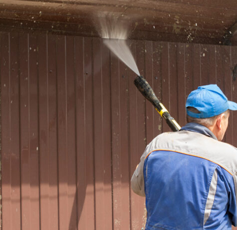 Vertical Siding Maintenance inspection and cleaning on a modern home's exterior